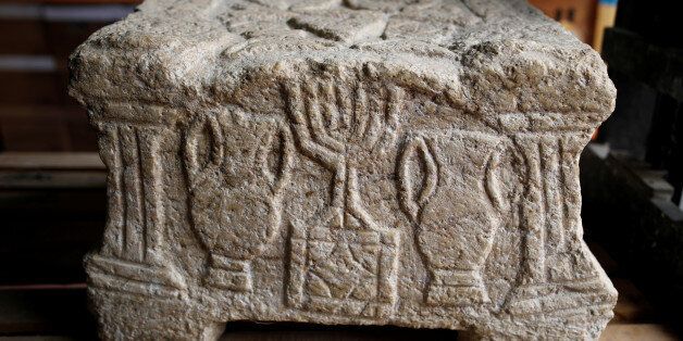 The Magdala Stone, one of the earliest known depictions of a Menorah, believed to be from the year 70 AD, is seen during a media tour presenting significant findings from the time of Jesus, at Israel's National Treasures Storeroom, in Beit Shemesh, Israel March 19, 2017. REUTERS/Amir Cohen