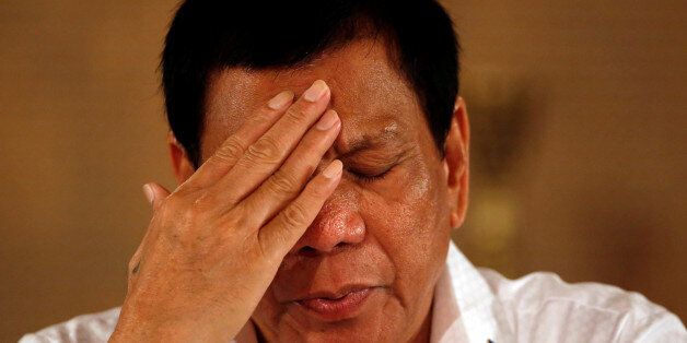 Philippine President Rodrigo Duterte reacts during a news conference at the presidential palace in Manila, Philippines March 13, 2017. REUTERS/Erik De Castro