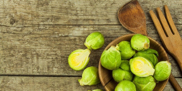 Brussels sprouts on old wooden table. Homework fresh vegetables. Growing vegetables on the farm. Preparing vegetarian food. Diet food.Brussels sprouts on old wooden table. Homework fresh vegetables. Growing vegetables on the farm. Preparing vegetarian food. Diet food.