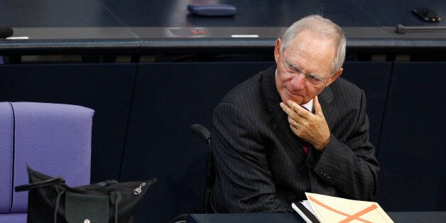 German Finance Minister Wolfgang Schaeuble attends a session of the Bundestag, the lower house of parliament, before a vote on a Spanish bank aid package in Berlin, July 19, 2012. Chancellor Angela Merkel's authority within her centre-right coalition was at stake on Thursday when uneasy German lawmakers vote on Berlin's contribution to a euro zone aid package for Spain's ailing banks. REUTERS/Thomas Peter (GERMANY - Tags: POLITICS BUSINESS)