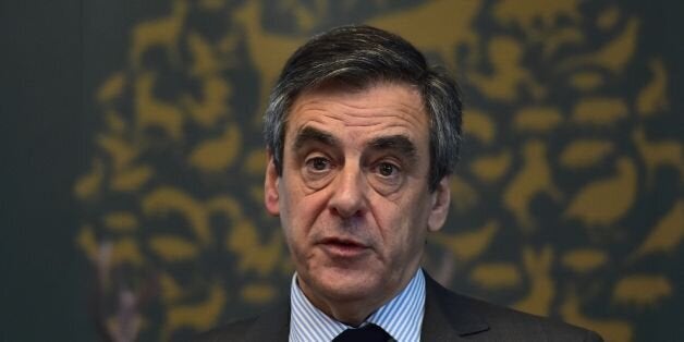 French presidential election candidate for the right-wing Les Republicains (LR) party Francois Fillon (C) delivers a speech during a meeting of the General Assembly of the French National Federation of Hunters on March 14, 2017 in Paris. France's rightwing presidential candidate Francois Fillon has been charged with several offences over a fake jobs scandal, including for misuse of public funds, his lawyer told AFP on March 14, 2017. / AFP PHOTO / CHRISTOPHE ARCHAMBAULT (Photo credit should read CHRISTOPHE ARCHAMBAULT/AFP/Getty Images)