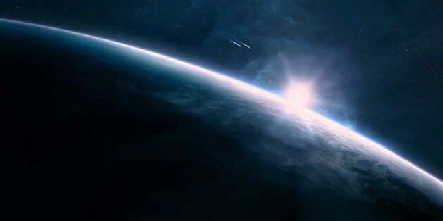 Digitally created scene of a sunrise in space
