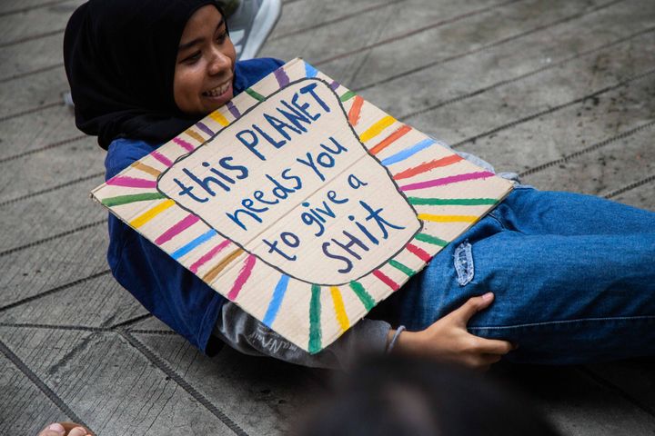 Thai people take part in a "die-in", where strikers lie on the ground and pretend to die, symbolising the impact of climate change in front of the Ministry of Natural Resources and Environment on September 20, 2019 in Bangkok, Thailand.