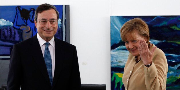 German Chancellor Angela Merkel (R) and Bank of Italy Governor and candidate for European Central Bank (ECB) president Mario Draghi attend a photocall at the Chancellery in Berlin June 16, 2011. REUTERS/Fabrizio Bensch (GERMANY - Tags: POLITICS BUSINESS)