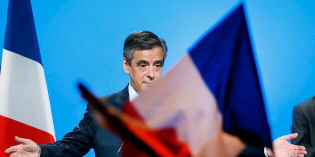 AUBERVILLIERS, FRANCE - MARCH 04: French presidential election candidate for the right-wing 'Les Republicains' (LR) party Francois Fillon acknowledges the public after a campaign rally to present his program on March 4, 2017, in Aubervilliers, France. Francois Fillon announced this week that he will be placed under formal investigation. Despite the desertion of the members of his party who asked him to give up the presidential election, Francois Fillon decided to maintain his candidacy and will hold a large rally tomorrow 'place du Trocadero' in front of the Eiffel Tower. (Photo by Chesnot/Getty Images)