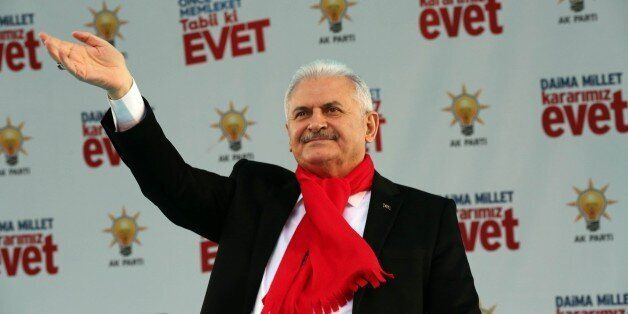NEVSEHIR, TURKEY - MARCH 04: Turkish Prime Minister and the leader of the Turkey's ruling Justice and Development Party (AK Party), Binali Yildirim greets the crowd during the meeting as part of a campaign for constitutional amendment referendum in April, at Dirilis Square in Nevsehir, Turkey on March 04, 2017. (Photo by Utku Ucrak/Anadolu Agency/Getty Images)