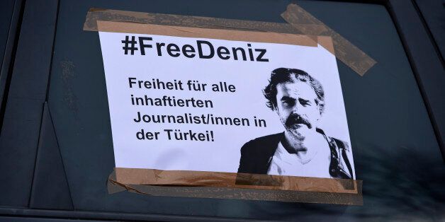 HANOVER, GERMANY - FEBRUARY 28: A leaflet is sticked at the side window of a car reading '#FreeDeniz - Freedom for all imprisoned Journalists in Turkey' before a motorcade demonstration to demand the release of German journalist Deniz Yucel on February 28, 2017 in Hanover, Germany. Yucel, who has both German and Turkish citizenship, is a correspondent for the German newspaper Die Welt and was arrested by Turkish authorities about two weeks ago. They accuse him of promoting propaganda for Kurdish