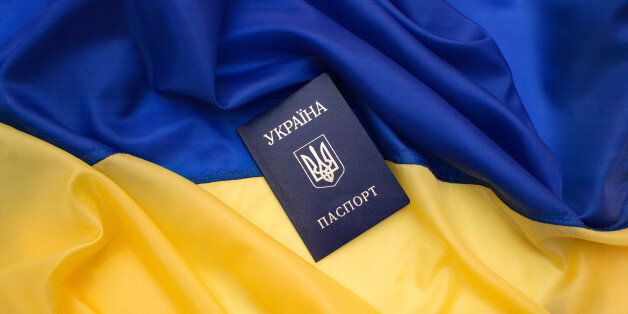 Ukrainian passport on the flag of Ukraine