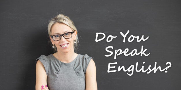 Woman with crossed hands standing and promoting english courses