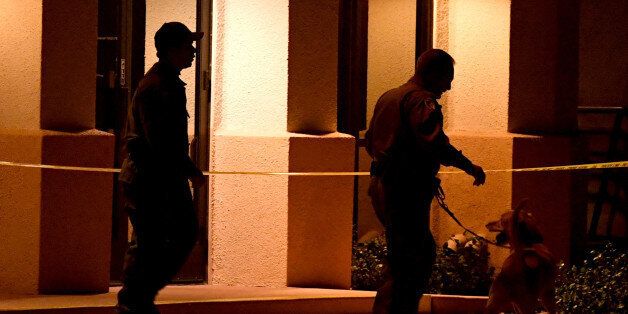 LAS VEGAS, NV - FEBRUARY 27: Las Vegas Metropolitan Police Department K-9 officers search the Jewish Community Center of Southern Nevada after an employee received a suspicious phone call that led about 10 people to evacuate the building on February 27, 2017 in Las Vegas, Nevada. Metro Police spokesman Danny Cordero said the nature of the call led officers to believe there might be a suspicious device inside but none was found. Cordero said police are stepping up patrols around Jewish institutions in Las Vegas following the fifth wave of bomb threats since January against Jewish community centers and schools across the country on Monday and recent vandalism of Jewish cemeteries. (Photo by Ethan Miller/Getty Images)