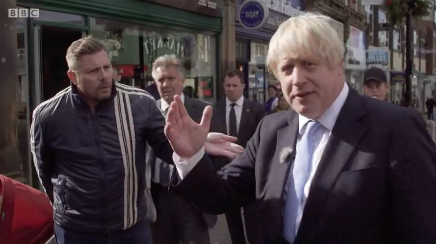 Boris Johnson being heckled during a walkabout in Morley, Leeds 