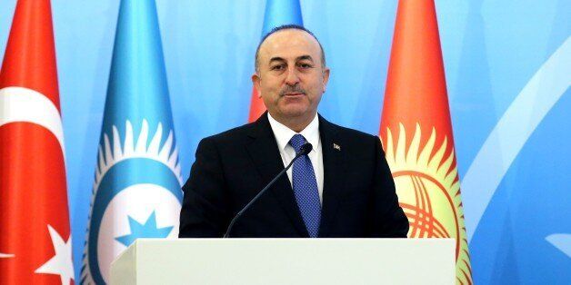 ANKARA, TURKEY - FEBRUARY 22: Turkish Foreign Minister Mevlut Cavusoglu delivers a speech during a conference on 25th anniversary of Khojaly Massacre, in Ankara, Turkey on February 22, 2017. (Photo by Rasit Aydogan/Anadolu Agency/Getty Images)