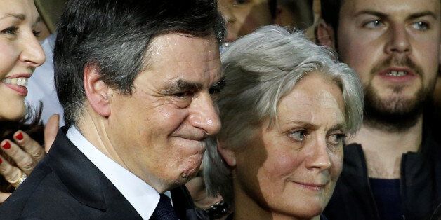 Francois Fillon, member of Les Republicains political party and 2017 presidential candidate of the French centre-right, and his wife Penelope attend a political rally in Paris, France, January 29, 2017. Picture taken January 29, 2017. REUTERS/Pascal Rossignol TPX IMAGES OF THE DAY