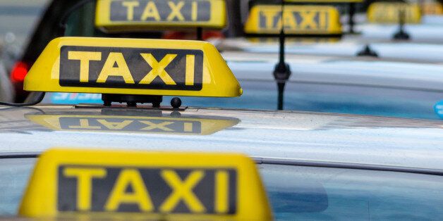 taxis wait at a taxi rank, symbolic photo for passenger transport and service