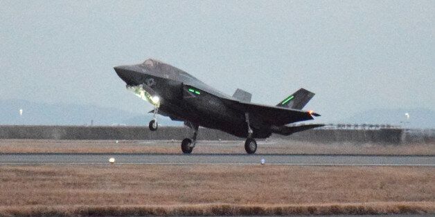 This picture taken on January 18, 2017 shows a US F-35B stealth fighter jet landing at the US Marine's Iwakuni Air Station in Iwakuni, Yamaguchi prefecture.The US Marine Corps said on January 11 it was sending a squadron of F-35B fighter jets to Japan, marking the first operational overseas deployment for the controversial aircraft that is under scrutiny from President-elect Donald Trump. / AFP / JIJI PRESS / JIJI PRESS / Japan OUT (Photo credit should read JIJI PRESS/AFP/Getty Images)