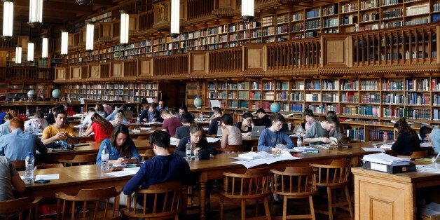 Students sit in the library of the university KU Leuven