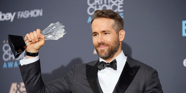 Actor Ryan Reynolds poses backstage with his award for Best Actor in a Comedy for