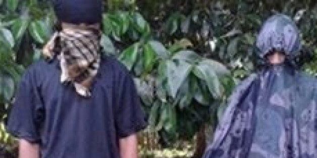 Hostages Canadian national Robert Hall (R) and Norwegian national Kjartan Sekkingstad (L) are seen in this undated picture released to local media, in Jolo island in southern Philippines. The Philippines confirmed on Tuesday the execution of Robert Hall, a Canadian who had been held hostage by the al Qaeda-linked Abu Sayyaf Islamist militant group on a remote southern island with three other people since September 2015. Handout/ via REUTERS ATTENTION EDITORS - THIS IMAGE WAS PROVIDED BY A THIRD PARTY. FOR EDITORIAL USE ONLY. TPX IMAGES OF THE DAY