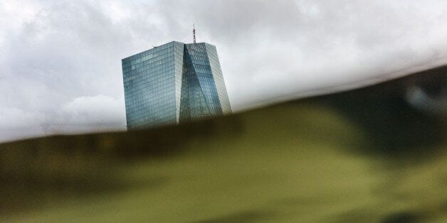 The headquarters of the European Central Bank (ECB) can be seen behind the greenish water of the river Main in Frankfurt am Main, western Germany, in a picture taken on March 7, 2017 with an underwater camera. / AFP PHOTO / dpa / Frank Rumpenhorst / Germany OUT (Photo credit should read FRANK RUMPENHORST/AFP/Getty Images)