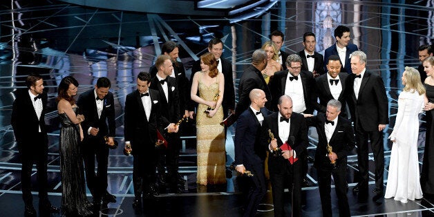 HOLLYWOOD, CA - FEBRUARY 26: Prior to learning of a presentation error, 'La La Land' producers Jordan Horowitz (speaking at microphone), Fred Berger and Marc Platt accept the Best Picture award for 'La La Land' (later awarded to actual Best Picture winner 'Moonlight') onstage during the 89th Annual Academy Awards at Hollywood & Highland Center on February 26, 2017 in Hollywood, California. (Photo by Kevin Winter/Getty Images)