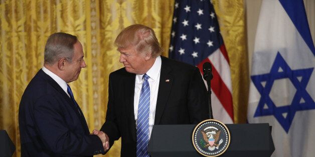 WASHINGTON, DC - FEBRUARY 15: U.S. President Donald Trump (R) and Israel Prime Minister Benjamin Netanyahu (L) shake hands during a joint news conference at the East Room of the White House February 15, 2017 in Washington, DC. President Trump hosted Prime Minister Netanyahu for talks for the first time since Trump took office on January 20. (Photo by Win McNamee/Getty Images)