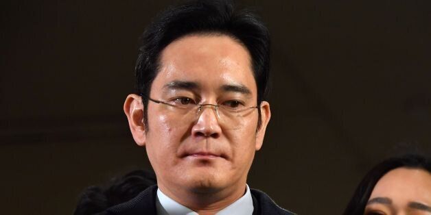 Lee Jae-yong, vice chairman of Samsung Electronics, arrives to be questioned as a suspect in a corruption scandal that led to the impeachment of South Korea's President Park Geun-Hye, at the office of the independent counsel in Seoul on February 13, 2017. / AFP / POOL / JUNG Yeon-Je (Photo credit should read JUNG YEON-JE/AFP/Getty Images)