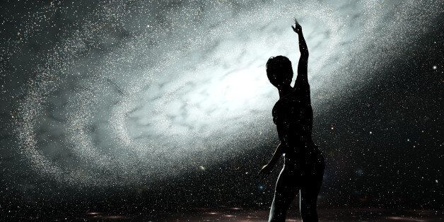 Female trying to touch the milkeyway's stars standing inside a fictive holography like projection of a galaxy. 3d render.