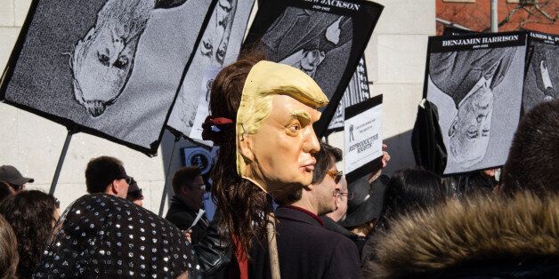 NEW YORK - FEBRUARY 18: Performers and protesters recreate a New Orleans style funeral burying the presidency, during Presidents' Day weekend, on February 18, 2017 in New York City.Hundreds of protesters rallied at Manhattans Washington Square Park around a mock cardboard casket that symbolically contained The American Presidency and also included a marching band as part of the protest.PHOTOGRAPH BY Joel Sheakoski / Barcroft ImagesLondon-T:+44 207 033 1031 E:hello@barcroftmedia.com -New York-T:+1 212 796 2458 E:hello@barcroftusa.com -New Delhi-T:+91 11 4053 2429 E:hello@barcroftindia.com www.barcroftimages.com (Photo credit should read Joel Sheakoski / Barcroft Images / Barcroft Media via Getty Images)