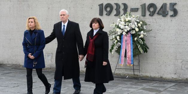 US Vice President Michael Richard Pence (C), his wife Karen Pence (R) and his daughter Charlotte Pence walk from the International Memorial of former Nazi concentration camp of Dachau after laying a wreath at the former Nazi concentration camp of Dachau, southwestern Germany, on February 19, 2017. / AFP / Thomas Kienzle (Photo credit should read THOMAS KIENZLE/AFP/Getty Images)