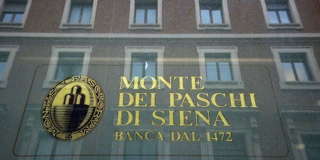 The logo of the Monte dei Paschi di Siena bank is seen on the window of a branch in downtown Rome on February 09, 2017.Banca Monte dei Paschi di Siena S.p.A. (BMPS) is the oldest surviving bank in the world and the third largest Italian commercial and retail bank by total assets. Founded in 1472 by the magistrates of the city state of Siena, as a 'mount of piety', it has been operating ever since. In 1995 the bank, then known as Monte dei Paschi di Siena, was transformed from a statutory corporation to a limited company called Banca Monte dei Paschi di Siena (Banca MPS). Since the end of 2016, the bank is struggling to avoid a collapse. / AFP / FILIPPO MONTEFORTE (Photo credit should read FILIPPO MONTEFORTE/AFP/Getty Images)