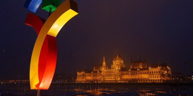 The Hungarian Parliament is seen behind Hungary's Olympic logo at a promotional spot as the Hungarian...