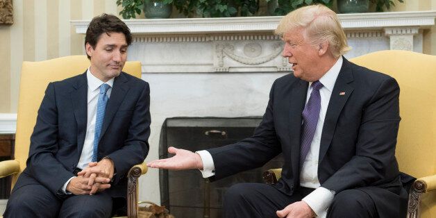WASHINGTON, DC - FEBRUARY 13: (AFP OUT) U.S. President Donald Trump (R) extends his hand to Prime Minister Justin Trudeau of Canada during a meeting in the Oval Office at the White House on February 13, 2017 in Washington, D.C. This is the first time the two leaders are meeting at the White House. (Photo by Kevin Dietsch-Pool/Getty Images)