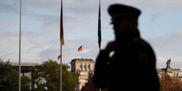 BERLIN, GERMANY - OCTOBER 19: The silhouette of a police officer is captured before meeting of the Normandy Contact Group on October 19, 2016 in Berlin, Germany. The Head of States of Russia, Ukraine and France get together with the German Chancellor to talk about the conflicts in Ukraine and Syria. (Photo by Florian Gaertner/Photothek via Getty Images)