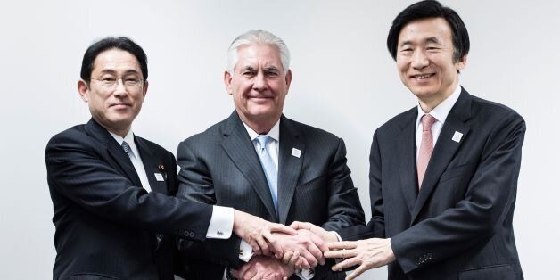 Japan's Foreign Minister Fumio Kishida (L), US Secretary of State Rex Tillerson (C) and South Korean Foreign Minister Yun Byung-Se (R) shake hands before a meeting at the World Conference Center February 16, 2017 in Bonn, Germany.US Secretary of State Rex Tillerson makes his diplomatic debut at a G20 gathering in Germany on February 16, 2017 where his counterparts hope to find out what 'America First' means for the rest of the world. / AFP / Brendan Smialowski (Photo credit should read BRENDAN SMIALOWSKI/AFP/Getty Images)