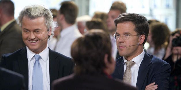 Dutch extreme-right MP Geert Wilders (L)' Party for Freedom Right-wing party is flanked by VVD leader (People's Party for Freedom and Democracy) Mark Rutte (R) ahead of a televised debate about the European Parliament elections in the Netherlands on June 04 2009 in The Hague, Netherlands. First results show that Wilders's party is taking 15.3 percent of the ballot and four seats in its first-ever campaign. the anti-Islamisation standard-bearer's PVV party was second only to Prime Minister Jan Peter Balkenende's Christian Democrats (CDA), which dropped nearly five percent to 19.6 percent and lost two of its seven European parliament seats. AFP PHOTO ANP ROBIN UTRECHT **NETHERLANDS OUT BELGIUM OUT** (Photo credit should read ROBIN UTRECHT/AFP/Getty Images)