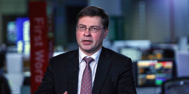 Valdis Dombrovskis, vice president of the European Commission, gestures while speaking during a Bloomberg Television interview in London, U.K., on Friday, Feb. 10, 2017. 'We are sensitive to talk of unpicking financial legislation which applies carefully negotiated international standards and rules,' Dombrovskis said in London on Friday. Photographer: Chris Ratcliffe/Bloomberg via Getty Images