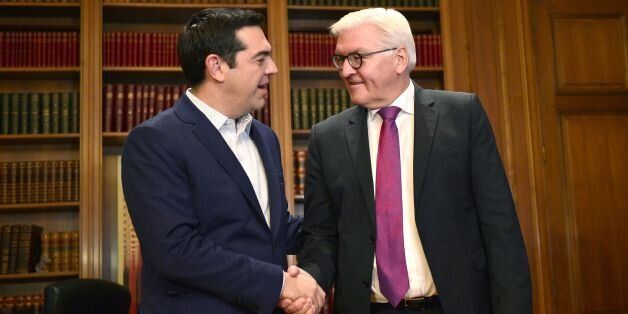Greek prime minister Alexis Tsipras (L) welcomes German Foreign Minister Frank-Walter Steinmeier prior to their talks in his office in Athens on December 5, 2016. / AFP / LOUISA GOULIAMAKI (Photo credit should read LOUISA GOULIAMAKI/AFP/Getty Images)