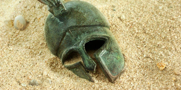 Greec helmet in sand