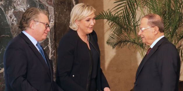 CORRECTION - France's far-right presidential candidate Marine Le Pen (C) and French MP Gilbert Collard greet with Lebanese President Michel Aoun (R) at the Presidential palace of Baabda, on February 20, 2017. / AFP / afp / AHMAD ABDO / The erroneous mention[s] appearing in the metadata of this photo by Anwar Amro has been modified in AFP systems in the following manner: [ANWAR AMRO] instead of [AHMAD ABDO]. Please immediately remove the erroneous mention[s] from all your online services and del