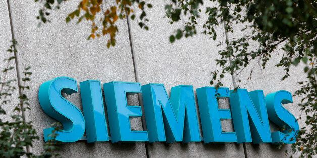 Siemens logo is pictured at Siemens Healthineers headquarters in Erlangen near Nuremberg, Germany, October 7, 2016. REUTERS/Michaela Rehle