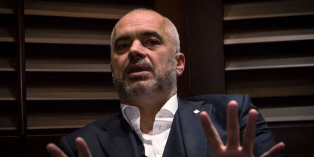 Albanian Prime Minister Edi Rama gestures during an interview in Belgrade on October 13, 2016. Serbia should recognise its former southern province Kosovo, which 'is a state,' Rama said on October 13 during a visit to Belgrade. 'It is over, Kosovo is a state, it is a state recognized by major world powers,' Rama told AFP, adding that 'people made their choice'. Kosovo unilaterally declared independence from Serbia in 2008, a decade after the end of the 1998-1999 war, but Belgrade, backed by its traditional ally Russia, has refused to recognise the move. / AFP / ANDREJ ISAKOVIC (Photo credit should read ANDREJ ISAKOVIC/AFP/Getty Images)