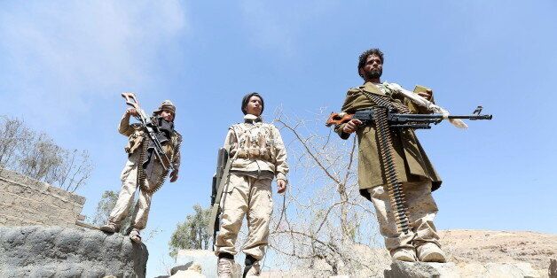 Pro-government army soldiers stand at the strategic Fardhat Nahm military camp, around 60km (40 miles) from Yemen's capital Sanaa, February 11, 2016. REUTERS/Ali Owidha