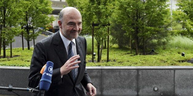 European Economic and Financial Affairs Commissioner Pierre Moscovici arrives at a Eurozone finance ministers emergency meeting on Greece in Brussels, Belgium June 22, 2015. A new Greek offer for a cash-for-reforms deal raised hopes of an agreement as euro zone leaders prepared for an emergency summit on Monday, with EU officials welcoming the proposals as a