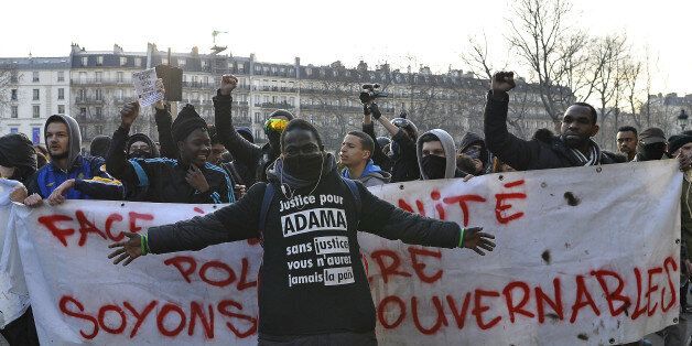 PARIS, FRANCE - FEBRUARY 18: A man wearing a t shirt asking for justice demonstrates during a anti-police brutality demonstration on February 18, 2017 in Paris, France. Violent protests have broken out across France after a 22-year old named Theo was admitted to hospital suffering serious injuries after allegedly being sodomized by police officers with a truncheon during his arrest on February 2nd. One of the four police officers present during the incident has now been charged with rape. (Photo by Aurelien Meunier/Getty Images)