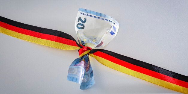 Berlin, Germany - February 14: In this Photo Illustration a 20 Euro bill is wrapped round with a ribbon in the national colors of Germany (black, red, gold) on February 14, 2017 in Berlin, Germany. (Photo by Thomas Trutschel/Photothek via Getty Images)