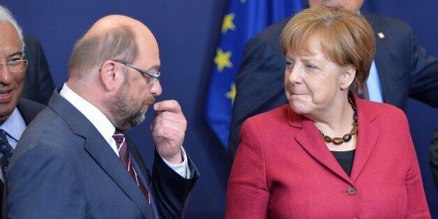 BRUSSELS, BELGIUM - MARCH 17: (R to L) German Chancellor Angela Merkel and President of European Parliament Martin Schultz talk together on the first day of two days longn European Union (EU) Summit at the Council of the European Union in Brussels, Belgium on March 17, 2016. (Photo by Dursun Aydemir/Anadolu Agency/Getty Images)