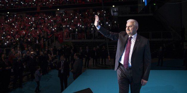 OBERHAUSEN, GERMANY - FEBRUARY 18: Turkish Prime Minister and the leader of Turkey's ruling Justice and Development Party (AK Party) Binali Yildirim salutes the people during an event named 'Homeland lovers say: Yes ', organized by his party's Europe Election Coordination Center prior to upcoming constitutional referandum on February 18, 2017 at Konig Pilsener Arena in Oberhausen, Germany. (Photo by Ali Balikci/Anadolu Agency/Getty Images)