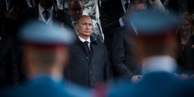 Belgrade, Serbia - October 16, 2014: Russian President seen through the soldiers during the military parade 'March of the victorious' in Belgrade. President Vladimir Putin of Russia arrived in Belgrade to commemorate the cityâs liberation by the Red Army and Yugoslav Partisans in 1944. during World War II.