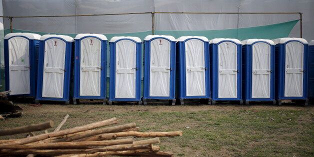 Temporary lavatories are seen at the venue of World Culture Festival on the banks of the river Yamuna in New Delhi, India, March 8, 2016. Indian environmentalists are aghast at the hosting of a huge cultural festival on the floodplain of Delhi's main river that begins on Friday, warning that the event and its 3.5 million visitors will devastate the area's biodiversity. Picture taken March 8, 2016. REUTERS/Anindito Mukherjee
