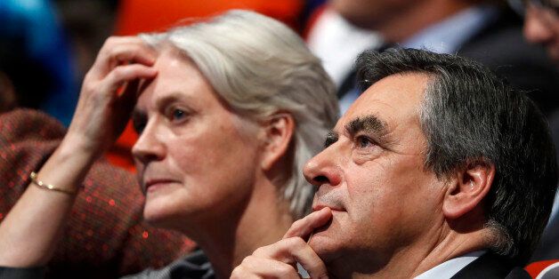 French politician Francois Fillon, member of the conservative Les Republicains political party and his wife Penelope (L) attend a final rally ahead of Sunday's first round of vote to choose the conservative candidate for France's presidential election in Paris, France, November 18, 2016. REUTERS/Charles Platiau